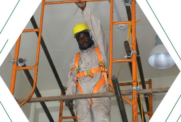 Fahrenheit technician wearing a safety harness while working at height